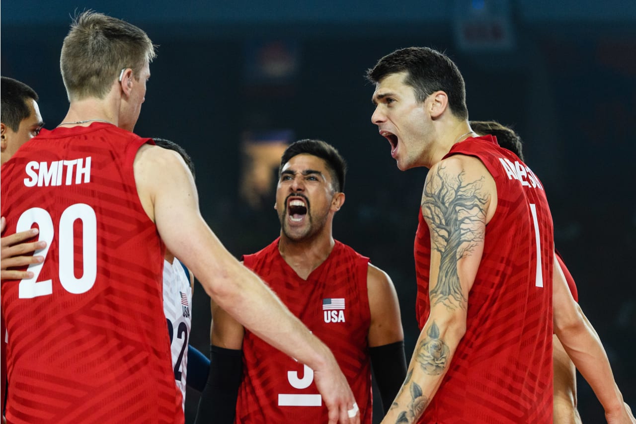 Matt Anderson celebrates a point with David Smith and Taylor Sander